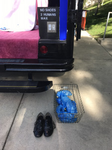 blue fabric and shoes outside Gas rear bumper