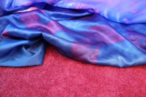 blue-purple fabric on red