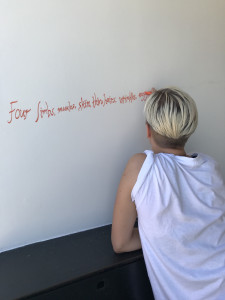 red text on wall of gallery